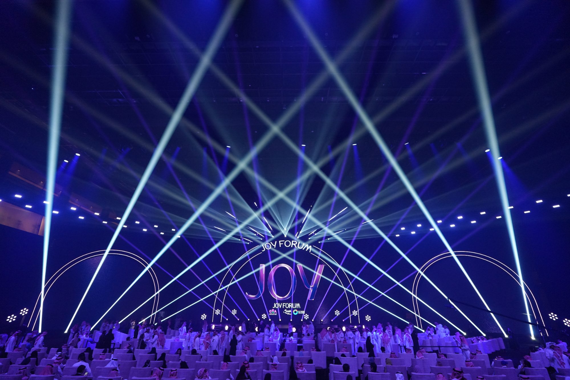 Conference stage production with LED backdrop at Joy Forum Riyadh